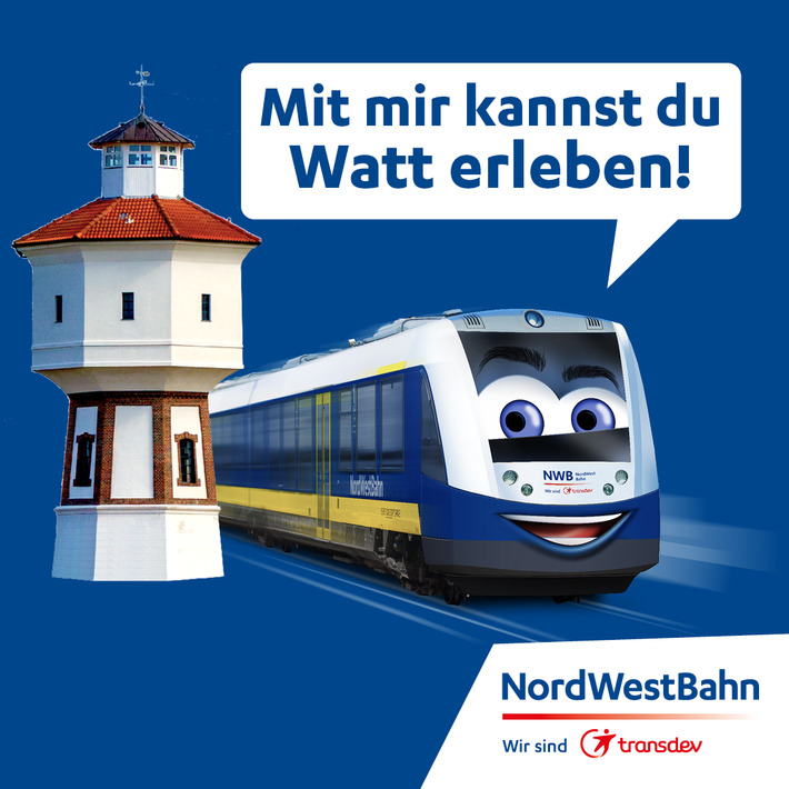 Wasserturm auf Langeoog und ein Zug der Nordwestbahn fährt vorbei